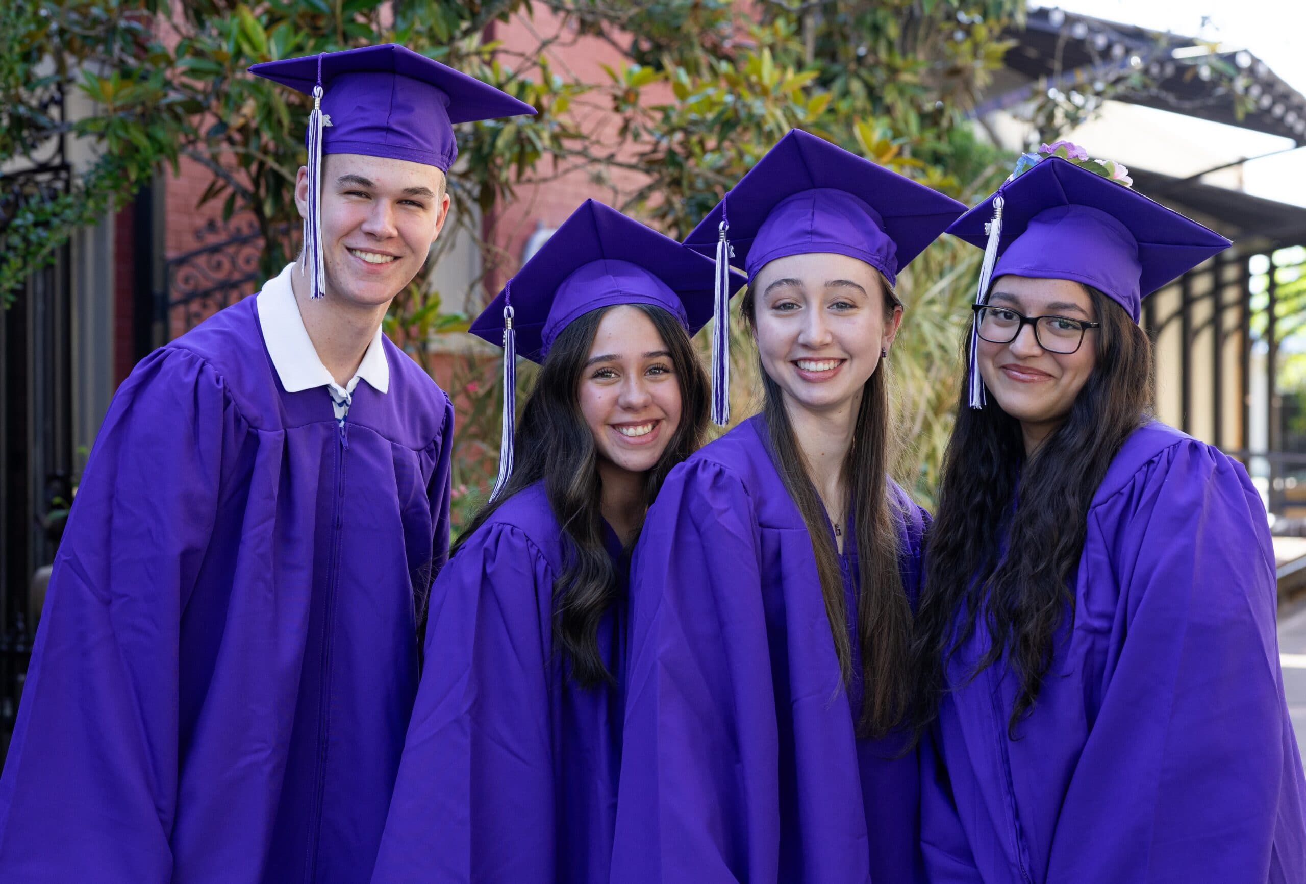 Citadel Christian School graduates wearing purple graduation caps and gowns